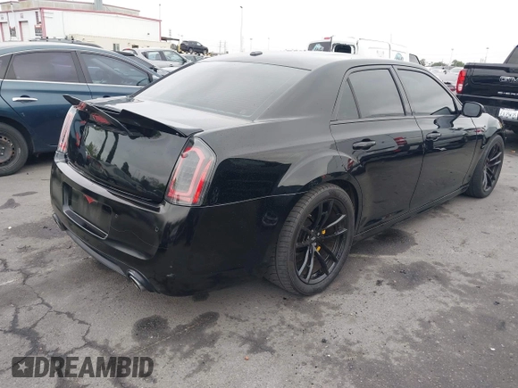 2013 Chrysler 300 SRT-8 with VIN 2C3CCAFJ9DH576184, listed as a IAAI auction lot 42162364 with 104,021 mi miles and . Bid and sale history available at carsss.com. Image 4.