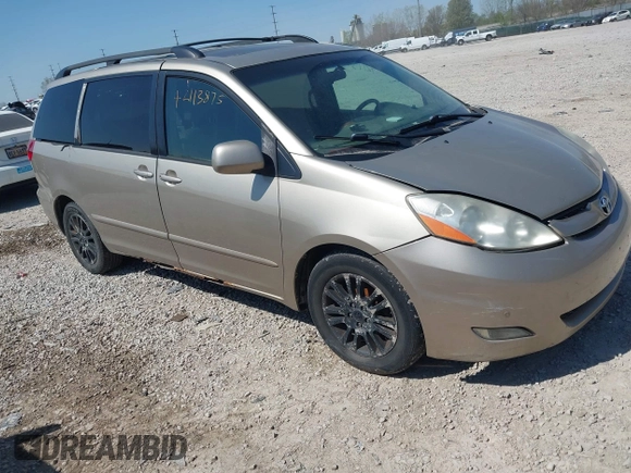 2009 Toyota Sienna XLE with VIN 5TDZK22CX9S257522, listed as a IAAI auction lot 42113875 with 214,873 mi miles. Bid and sale history available at carsss.com. Image 1.