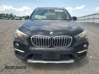 2017 BMW X1 xDrive28i with VIN WBXHT3C39H5F81200, listed as a Copart auction lot 55304485 with 88,948 mi miles and Salvage Title. Bid and sale history available at DreamBid. Image 5.