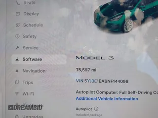 2022 Tesla Model 3 with VIN 5YJ3E1EA6NF144098, listed as a IAAI auction lot 41965360 with 75,597 mi miles. Bid and sale history available at carsss.com. Image 7.