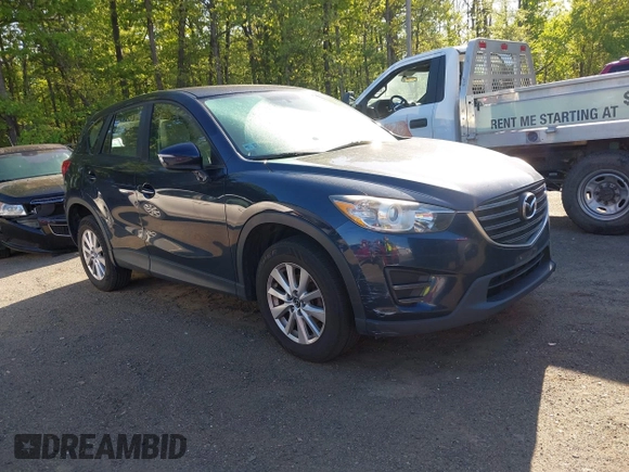 2016 Mazda CX-5 Sport with VIN JM3KE2BY3G0657904, listed as a IAAI auction lot 42127897 with 153,855 mi miles. Bid and sale history available at carsss.com. Image 1.