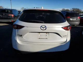2018 Mazda CX-5 Grand Touring z VIN JM3KFBDM6J0337006, wystawiony jako Copart lot #87155694 z przebiegiem 50 643 mil mil oraz Szkoda całkowita • Salvage title. Historia ofert i sprzedaży dostępna na DreamBid. Obrazek 6.