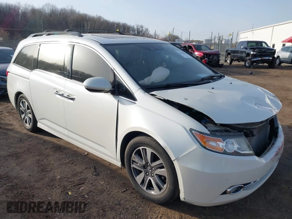 2014 Honda Odyssey Touring with VIN 5FNRL5H97EB037358, listed as a IAAI auction lot 41832825 with 208,894 mi miles and . Bid and sale history available at DreamBid. Image 1.