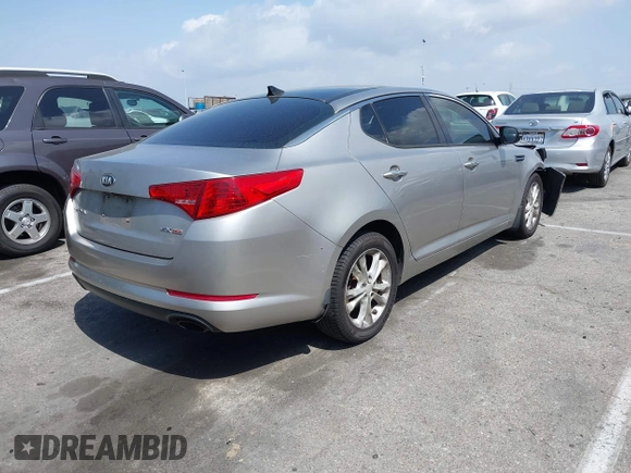 2013 Kia Optima EX z VIN 5XXGN4A70DG148060, wystawiony jako IAAI lot #41900134 z przebiegiem 149 214 mil mil oraz . Historia ofert i sprzedaży dostępna na DreamBid. Obrazek 4.