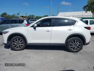 2018 Mazda CX-5 Grand Touring with VIN JM3KFADM2J1422512, listed as a IAAI auction lot 42010801 with 48,567 mi miles and . Bid and sale history available at DreamBid. Image 14.