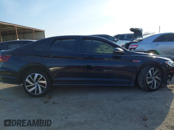 2019 Volkswagen Jetta GLI S z VIN 3VW5T7BU3KM245927, wystawiony jako IAAI lot #41573257 z przebiegiem 57 322 mil mil oraz . Historia ofert i sprzedaży dostępna na DreamBid. Obrazek 14.