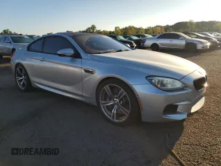 2013 BMW M6 z VIN WBSLX9C58DD159800, wystawiony jako Copart lot #68904984 z przebiegiem 107 426 mil mil oraz Szkoda całkowita • Salvage title. Historia ofert i sprzedaży dostępna na DreamBid. Obrazek 4.