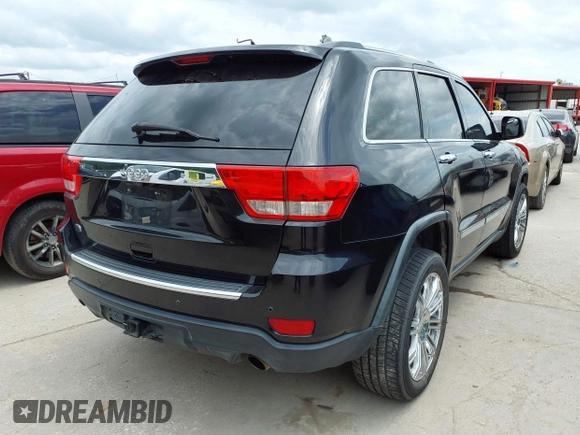 2013 Jeep Grand Cherokee Overland with VIN 1C4RJECT2DC588124, listed as a IAAI auction lot 42142573 with 204,309 mi miles and . Bid and sale history available at DreamBid. Image 4.