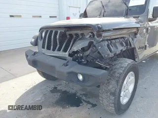 2020 Jeep Gladiator Sport S z VIN 1C6HJTAG7LL154664, wystawiony jako IAAI lot #42033131 z przebiegiem 73 282 mil mil oraz . Historia ofert i sprzedaży dostępna na DreamBid. Obrazek 6.