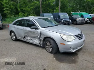 2010 Chrysler Sebring Touring z VIN 1C3CC4FB3AN203543, wystawiony jako Copart lot #57767985 z przebiegiem 152 951 mil mil oraz Szkoda całkowita • Salvage title. Historia ofert i sprzedaży dostępna na DreamBid. Obrazek 4.