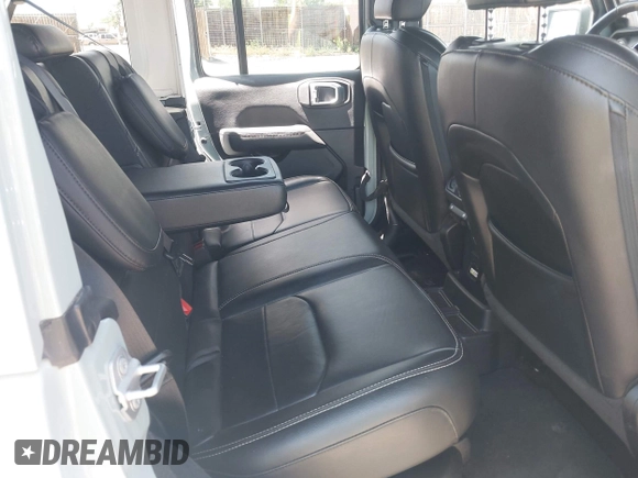 2023 Jeep Wrangler Sahara with VIN 1C4JJXP68PW627007, listed as a IAAI auction lot 42474745 with 57,912 mi miles and . Bid and sale history available at DreamBid. Image 8.