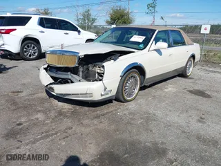 2001 Cadillac DeVille with VIN 1G6KD54Y91U230997, listed as a IAAI auction lot 41795864 with 379,025 mi miles. Bid and sale history available at carsss.com. Image 18.