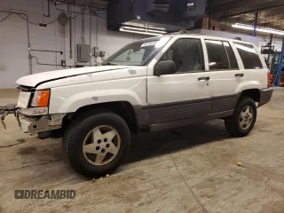 1993 Jeep Grand Cherokee Laredo with VIN 1J4GZ58SXPC554642, listed as a Copart auction lot 83268254 with 266,063 mi miles and Salvage Title. Bid and sale history available at carsss.com. Image 1.