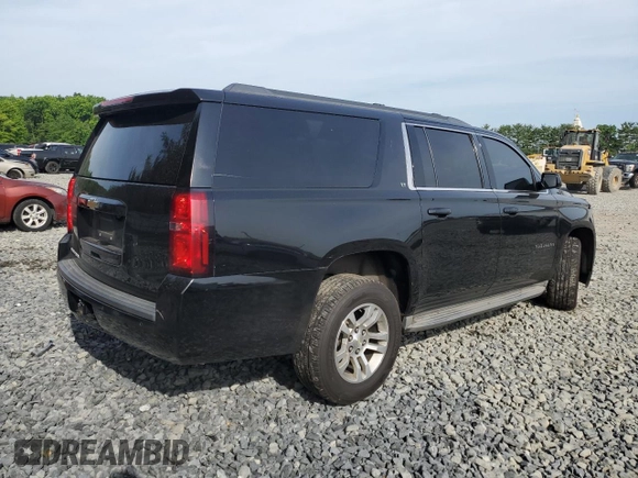 2015 Chevrolet Suburban LT with VIN 1GNSKJKC4FR192292, listed as a Copart auction lot 60434444 with 304,830 mi miles and Salvage Title. Bid and sale history available at DreamBid. Image 3.