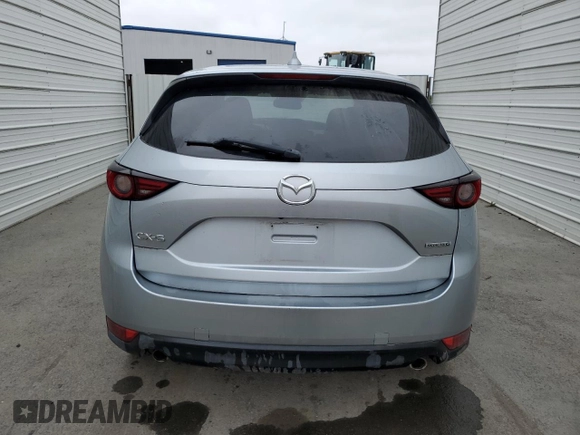 2021 Mazda CX-5 Grand Touring z VIN JM3KFADM7M1339081, wystawiony jako Copart lot #58913585 z przebiegiem Nie podano mil oraz Szkoda całkowita • Salvage title. Historia ofert i sprzedaży dostępna na DreamBid. Obrazek 6.