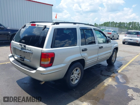 2004 Jeep Grand Cherokee Laredo with VIN 1J4GX48S34C258227, listed as a IAAI auction lot 42616107 with 160,424 mi miles and . Bid and sale history available at DreamBid. Image 4.