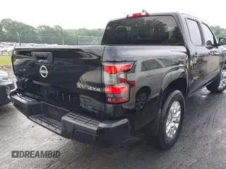 2023 Nissan Frontier SV with VIN 1N6ED1EK7PN609865, listed as a IAAI auction lot 42242070 with 56,462 mi miles and . Bid and sale history available at DreamBid. Image 4.