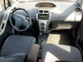 2009 Toyota Yaris with VIN JTDKT903795233081, listed as a Copart auction lot 56407165 with 172,631 mi miles and Clean Title. Bid and sale history available at DreamBid. Image 8.