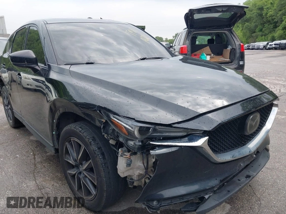 2018 Mazda CX-5 Grand Touring with VIN JM3KFBDM2J0400828, listed as a IAAI auction lot 42540846 with 254,672 mi miles and . Bid and sale history available at DreamBid. Image 17.