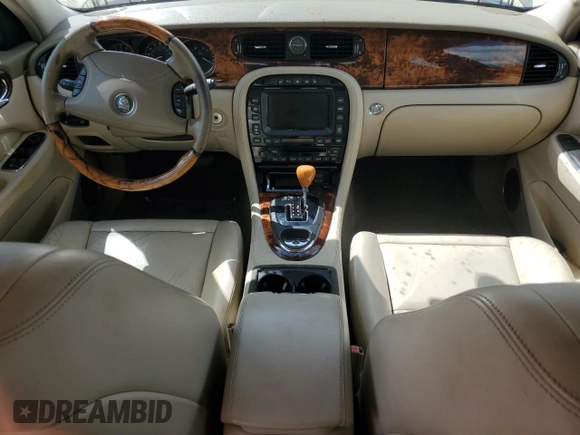 2004 Jaguar XJ with VIN SAJWA71C24SG28164, listed as a Copart auction lot 73968134 with 0 mi miles and Salvage Title. Bid and sale history available at carsss.com. Image 8.
