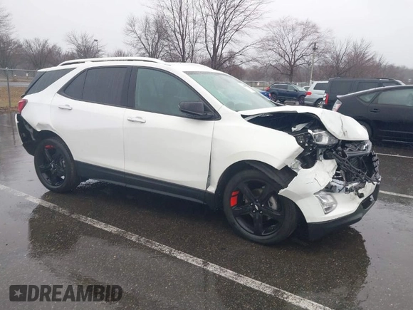 2021 Chevrolet Equinox Premier z VIN 2GNAXNEV7M6112087, wystawiony jako IAAI lot #41102702 z przebiegiem 32 995 mil mil oraz . Historia ofert i sprzedaży dostępna na DreamBid. Obrazek 1.
