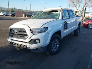 2017 Toyota Tacoma SR5 with VIN 3TMAZ5CN8HM040978, listed as a IAAI auction lot 41847492 with 103,731 mi miles and . Bid and sale history available at DreamBid. Image 2.