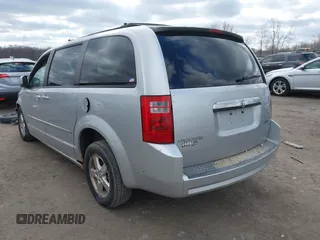2010 Dodge Grand Caravan SXT with VIN 2D4RN5D13AR180609, listed as a IAAI auction lot 41857215 with Not Provided miles and . Bid and sale history available at DreamBid. Image 3.