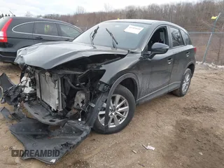 2015 Mazda CX-5 Sport with VIN JM3KE4BY9F0495948, listed as a IAAI auction lot 41501840 with 145,959 mi miles. Bid and sale history available at carsss.com. Image 2.