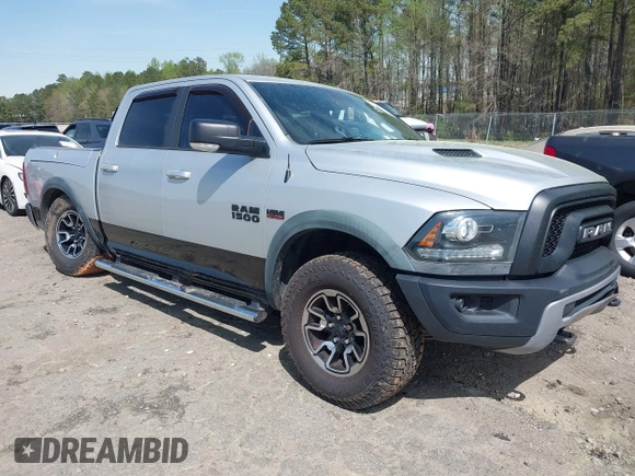 2015 Ram 1500 Rebel z VIN 1C6RR7YT0FS751334, wystawiony jako IAAI lot #41933040 z przebiegiem 167 336 mil mil oraz . Historia ofert i sprzedaży dostępna na DreamBid. Obrazek 1.