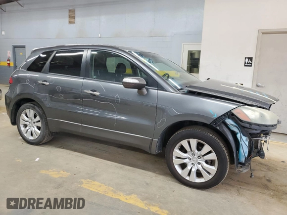 2010 Acura RDX with VIN 5J8TB2H26AA000932, listed as a Copart auction lot 70211954 with 199,671 mi miles and Salvage Title. Bid and sale history available at carsss.com. Image 4.