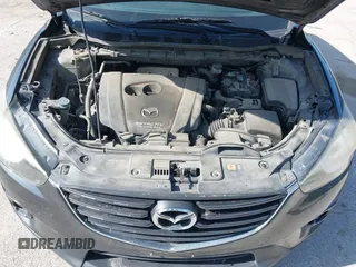 2016 Mazda CX-5 Touring z VIN JM3KE2CY4G0708972, wystawiony jako IAAI lot #42043013 z przebiegiem 157 573 mil mil oraz . Historia ofert i sprzedaży dostępna na DreamBid. Obrazek 10.