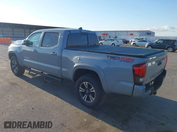 2018 Toyota Tacoma SR5 with VIN 3TMDZ5BN3JM054548, listed as a IAAI auction lot 42038480 with 122,242 mi miles and . Bid and sale history available at DreamBid. Image 3.