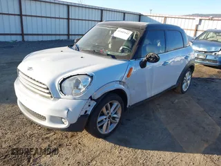 2012 MINI Countryman with VIN WMWZB3C55CWM03612, listed as a IAAI auction lot 41445142 with 217,495 mi miles and . Bid and sale history available at DreamBid. Image 2.