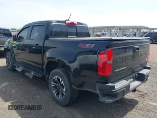 2021 Chevrolet Colorado 4WD Z71 z VIN 1GCGTDEN1M1256939, wystawiony jako IAAI lot #42071364 z przebiegiem 38 972 mil mil oraz . Historia ofert i sprzedaży dostępna na DreamBid. Obrazek 3.