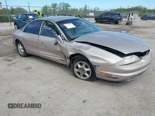 1999 Oldsmobile Aurora z VIN 1G3GR62C5X4114285, wystawiony jako IAAI lot #42271517 z przebiegiem 308 731 mil mil oraz . Historia ofert i sprzedaży dostępna na DreamBid. Obrazek 1.