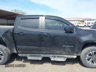 2021 Chevrolet Colorado 4WD Z71 z VIN 1GCGTDEN1M1256939, wystawiony jako IAAI lot #42071364 z przebiegiem 38 972 mil mil oraz . Historia ofert i sprzedaży dostępna na DreamBid. Obrazek 13.