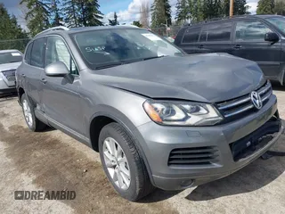 2014 Volkswagen Touareg Sport with VIN WVGEF9BP2ED005506, listed as a IAAI auction lot 41819422 with 131,994 mi miles and . Bid and sale history available at DreamBid. Image 1.