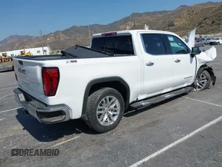 2022 GMC Sierra 1500 SLT with VIN 3GTU9DED3NG156904, listed as a IAAI auction lot 42429722 with 59,717 mi miles and . Bid and sale history available at DreamBid. Image 4.