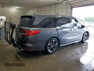 2023 Honda Odyssey Elite with VIN 5FNRL6H98PB056770, listed as a Copart auction lot 56984055 with Not provided miles and Salvage title. Bid and sale history available at DreamBid. Image 3.