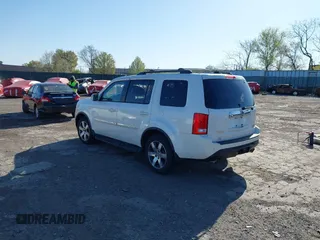 2012 Honda Pilot Touring with VIN 5FNYF4H98CB057659, listed as a IAAI auction lot 41927990 with 140,000 mi miles. Bid and sale history available at carsss.com. Image 3.