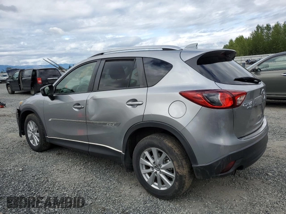 2014 Mazda CX-5 Touring z VIN JM3KE4CY0E0407169, wystawiony jako Copart lot #57877215 z przebiegiem 168 277 mil mil oraz Szkoda całkowita • Salvage title. Historia ofert i sprzedaży dostępna na DreamBid. Obrazek 2.