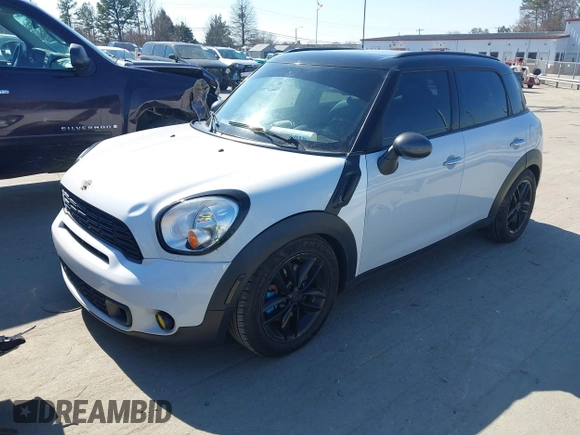 2014 MINI Countryman S with VIN WMWZC3C52EWP25060, listed as a IAAI auction lot 41642855 with 240,396 mi miles and . Bid and sale history available at DreamBid. Image 2.