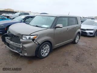 2011 Scion xB with VIN JTLZE4FE9B1141752, listed as a IAAI auction lot 41797088 with 114,357 mi miles. Bid and sale history available at carsss.com. Image 2.