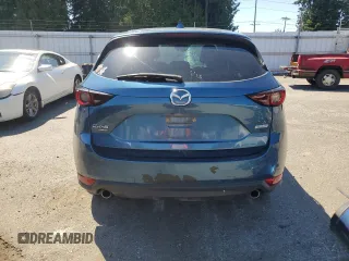 2018 Mazda CX-5 Touring z VIN JM3KFBCM2J1363310, wystawiony jako Copart lot #58969135 z przebiegiem 86 831 mil mil oraz Szkoda całkowita • Salvage title. Historia ofert i sprzedaży dostępna na DreamBid. Obrazek 6.
