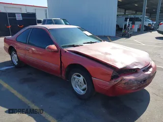 1996 Ford Thunderbird LX with VIN 1FALP62W0TH142986, listed as a IAAI auction lot 42030900 with 168,993 mi miles. Bid and sale history available at carsss.com. Image 1.