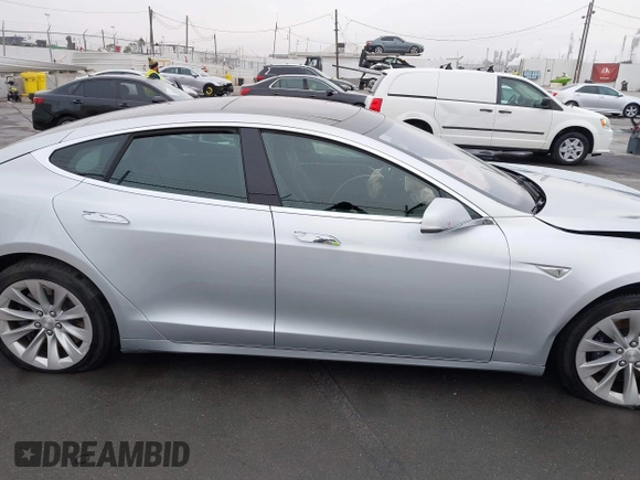 2016 Tesla Model S 70 with VIN 5YJSA1E17GF156514, listed as a IAAI auction lot 41869006 with 17,704 mi miles and . Bid and sale history available at DreamBid. Image 13.