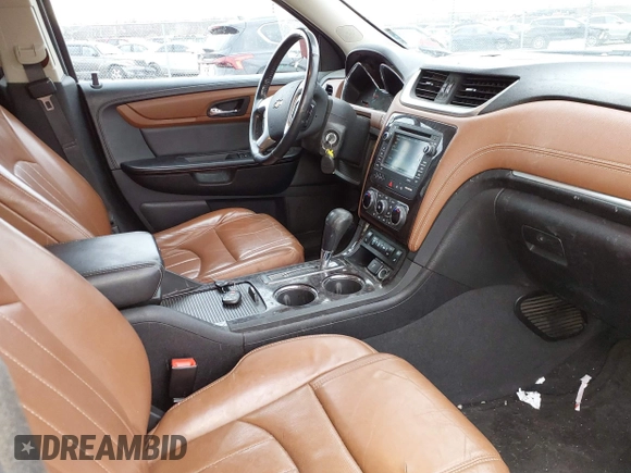 2016 Chevrolet Traverse LTZ z VIN 1GNKVJKD8GJ167038, wystawiony jako IAAI lot #41878254 z przebiegiem 159 771 mil mil oraz . Historia ofert i sprzedaży dostępna na DreamBid. Obrazek 5.