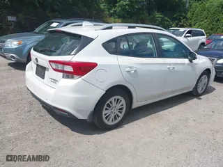 2017 Subaru Impreza Premium with VIN 4S3GTAD67H3748698, listed as a IAAI auction lot 39917558 with 56,945 mi miles. Bid and sale history available at carsss.com. Image 4.