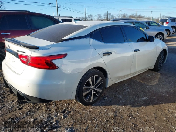 2018 Nissan Maxima SV with VIN 1N4AA6AP7JC372246, listed as a IAAI auction lot 41387139 with 104,686 mi miles and . Bid and sale history available at DreamBid. Image 4.