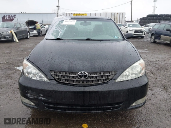 2003 Toyota Camry LE with VIN 4T1BE30K13U144114, listed as a IAAI auction lot 41829879 with 60,385 mi miles and . Bid and sale history available at DreamBid. Image 12.